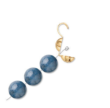 a bead strand is threaded through a bead tips back and knotted.